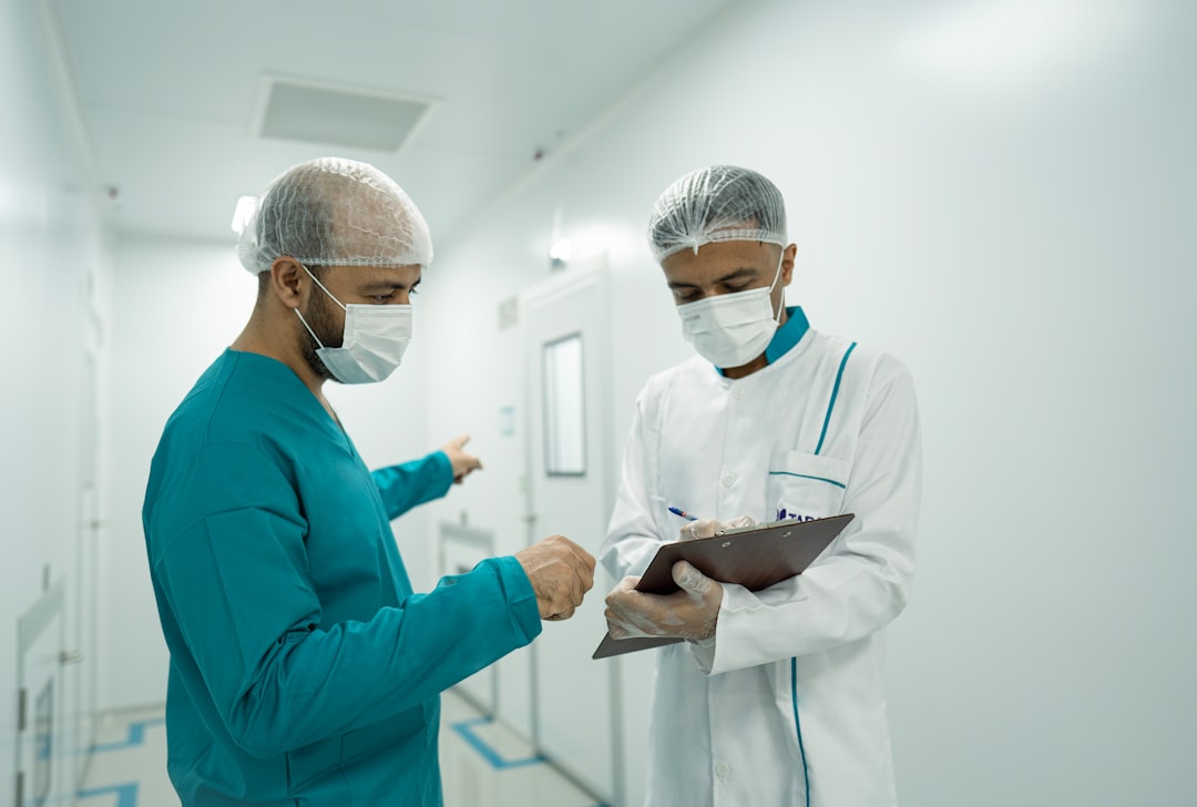 Medical staff reviewing a patient's chart at a Chinese hospital